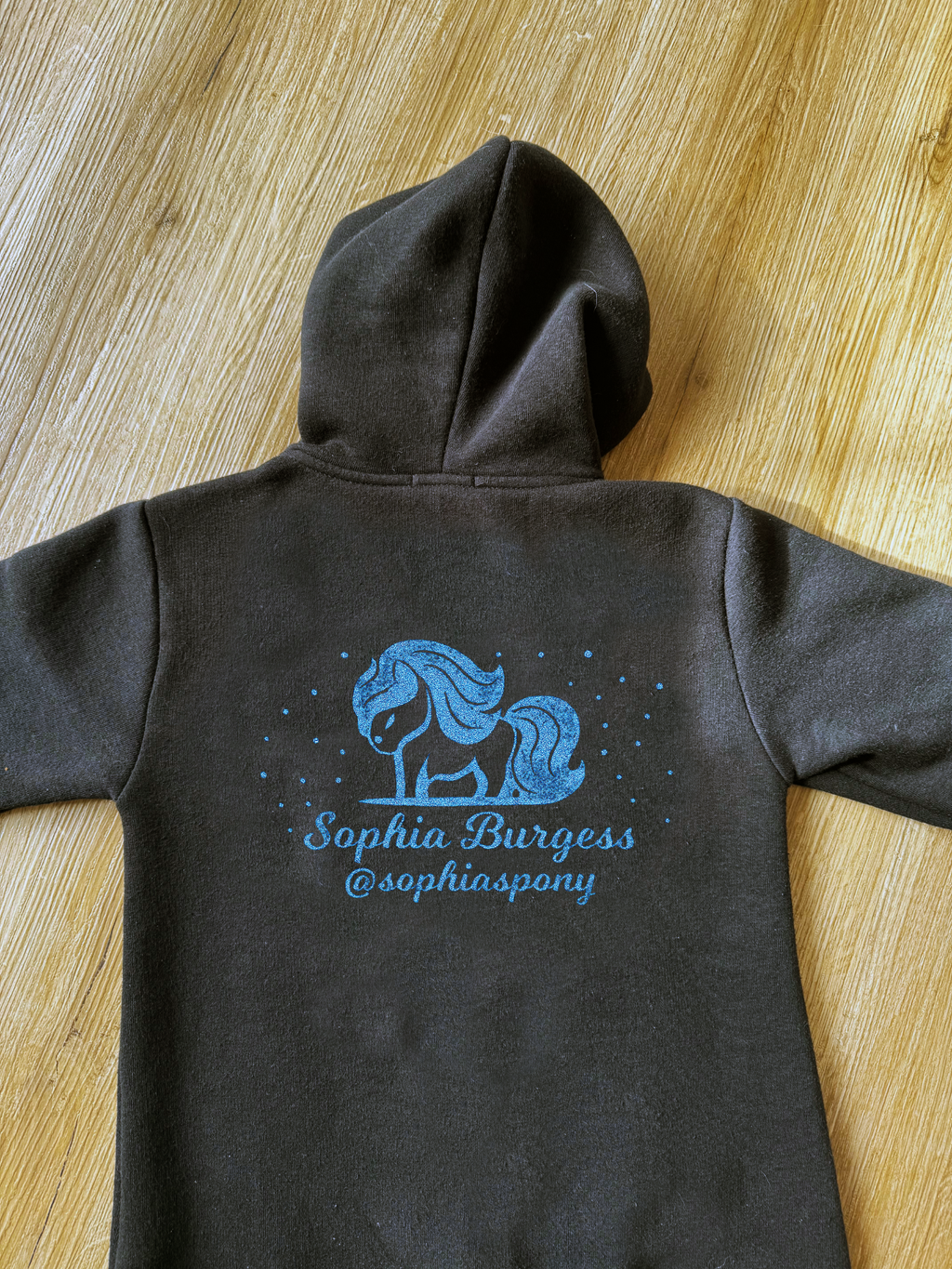 Personalised Pony Onesie Black with Blue Pony Logo and name